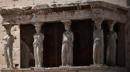 Stone carvings of female figures act as pillars at the "Porch of the Maidens" in Athens, Greece. 