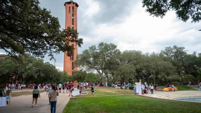 Students gather during an event by the Tower